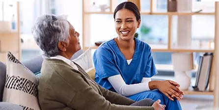 St Peter's employee talking to a patient